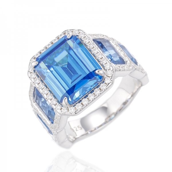 Anello in argento placcato rodio con zirconi cubici di apatite al neon con taglio smeraldo e spinello blu 